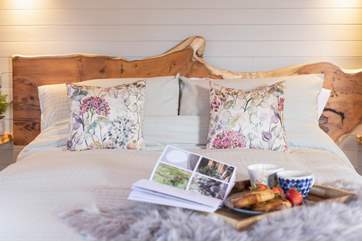 This bespoke hand-carved headboard makes a beautiful feature.