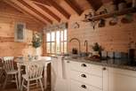 Or rustle up some culinary delights in the charming fully equipped kitchen. 