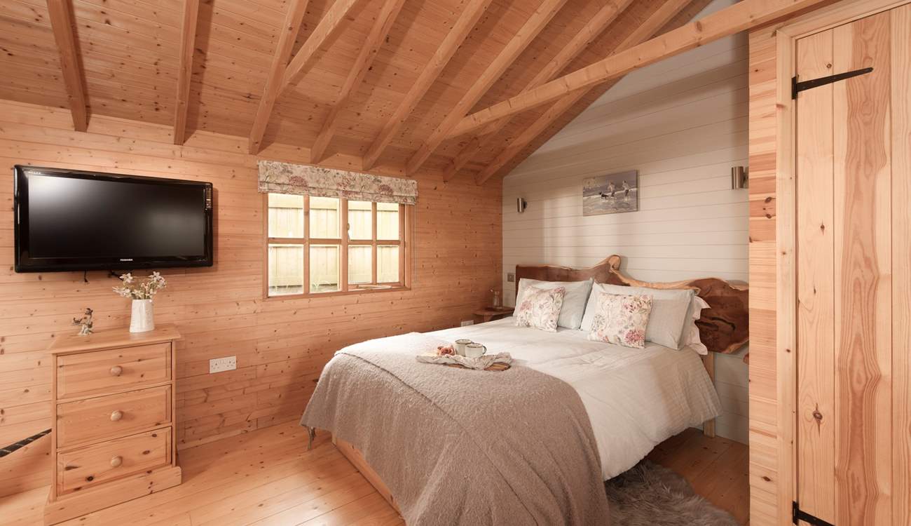 This bespoke hand-carved headboard makes a beautiful feature.