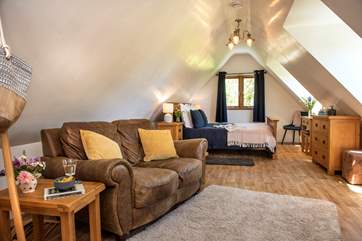 The lovely open plan living-room and bedroom are on the first floor.