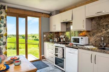 The setting is simply sublime and the sliding doors in the kitchen/dining-room perfectly frame the view.