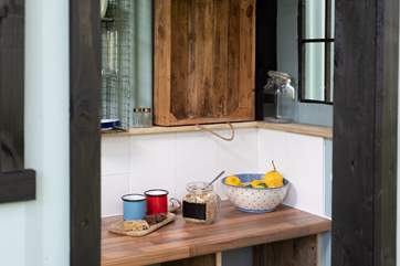 Enjoy preparing a tasty breakfast in the crisp morning breeze.
