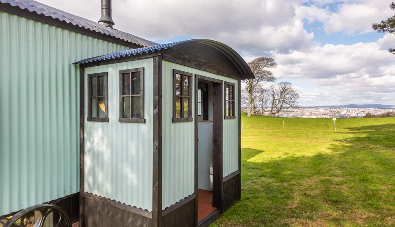 The compact kitchen can be found at the rear of the hut.