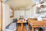 Enjoy scrumptious meals around the rustic dining table and when you are ready for a good night's sleep, the double bed easily folds down from the wall to sit atop the table. 