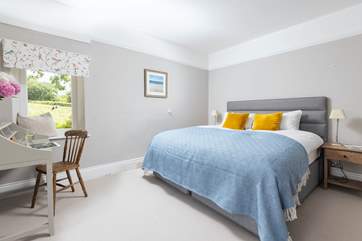 The second bedroom also boasts idyllic countryside views.