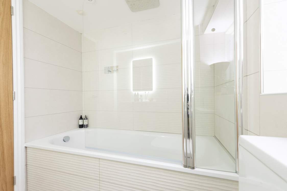 The contemporary family bathroom, located on the ground floor.