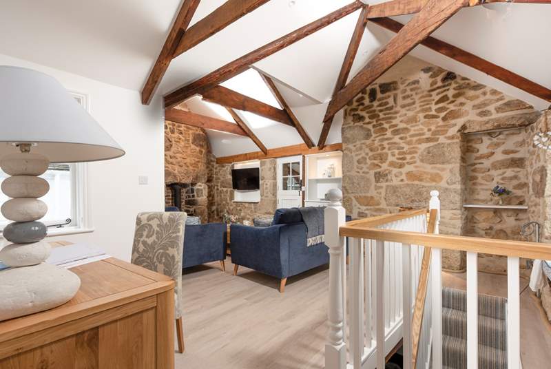 Head up the narrow, steep stairs and you are straight into the gorgeous sitting-room complete with roaring wood-burner, perfect for those chillier days.
