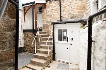 The Hideaway is tucked away in a secluded spot reached via a little cobbled lane. 13 steps lead up to the first floor stable-door..