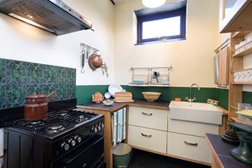 A touch of history marries seamlessly with modern equipment in the kitchen.