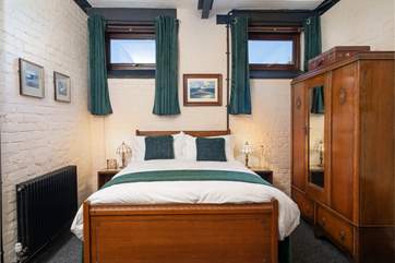 A hushed room for a peaceful night's sleep after a day exploring the coastal path.