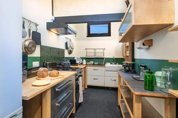 A touch of history marries seamlessly with modern equipment in the kitchen.
