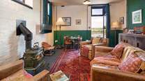 Take time away from it all in the simplicity of the 1940s Mess Room with the glorious antique wood-burner. 