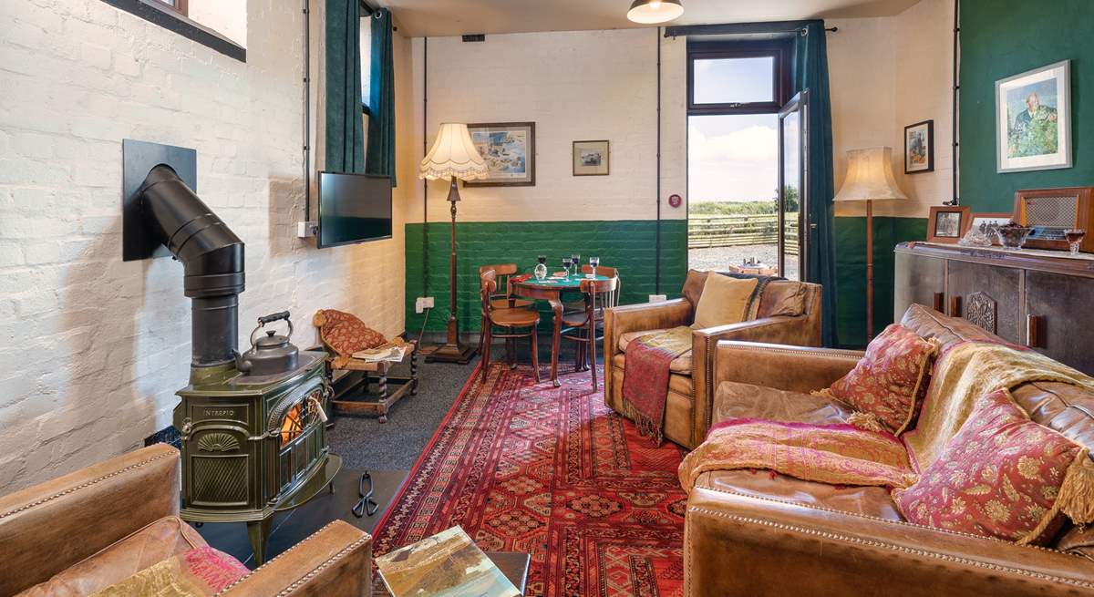 Take time away from it all in the simplicity of the 1940s Mess Room with the glorious antique wood burner. 