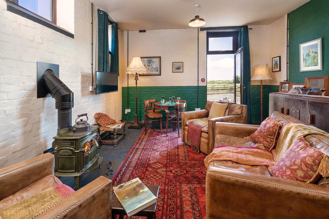 Take time away from it all in the simplicity of the 1940s Mess Room with the glorious antique wood burner. 