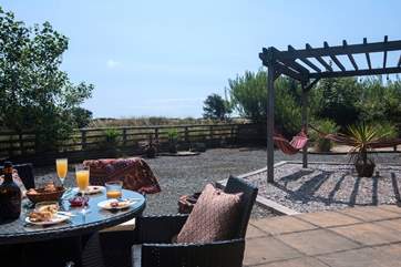 Gaze across the fields from this idyllic sunny spot. Relax in the hammocks with you favourite book.