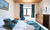 Fluffy white towels and crisp white linen in this charming 1940s bedroom. - Thumbnail Image