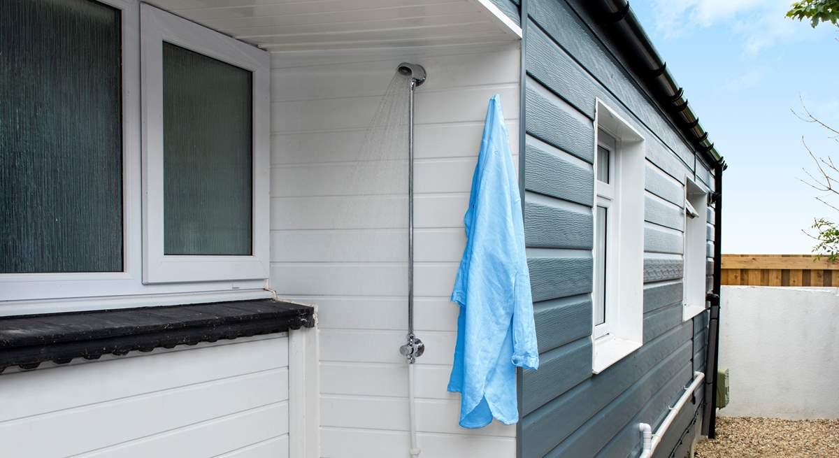 Bossiney Cabin even has an outdoor shower, [perfect for rinsing off after a day at the beach- there also secure storage for surfboards and bicycles