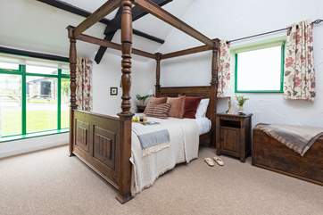 A great night's sleep is assured in the fabulous, crafted king-size four-poster bed.