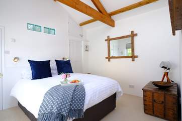 The comfy double room has a vaulted ceiling.