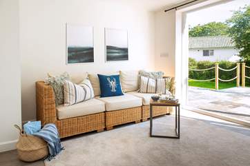 There's also a little snug with another TV and doors leading out to the garden.