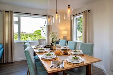 Plenty of room for all to gather around the dining-table.