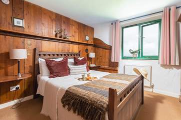 The double bedroom has fabulous countryside views, and the wood from the original stables has been used to create character and charm!