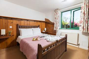 The bedroom has elements of the original stables adding a lovely touch to this bedroom.