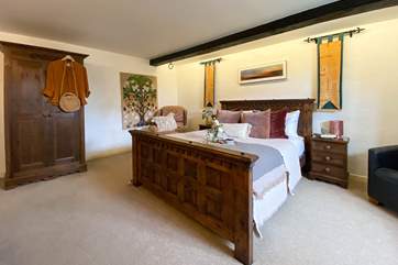 How beautiful is this hand-crafted bed with luxury linens?