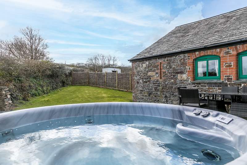 Enjoy the hot tub in the back garden the perfect end to any day when staying at Duchy Cottage.