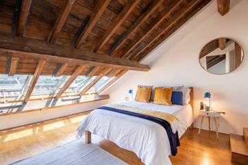 The main bedroom with a double bed and amazing views over Plymouth harbour.