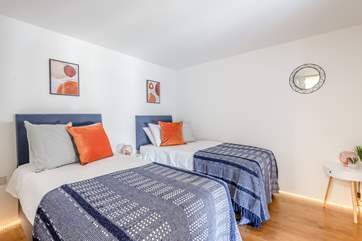 Bedroom 2 can be a twin room or made into a double. This bedroom does not have a window but when the pocket door is open you can see across the harbour.
