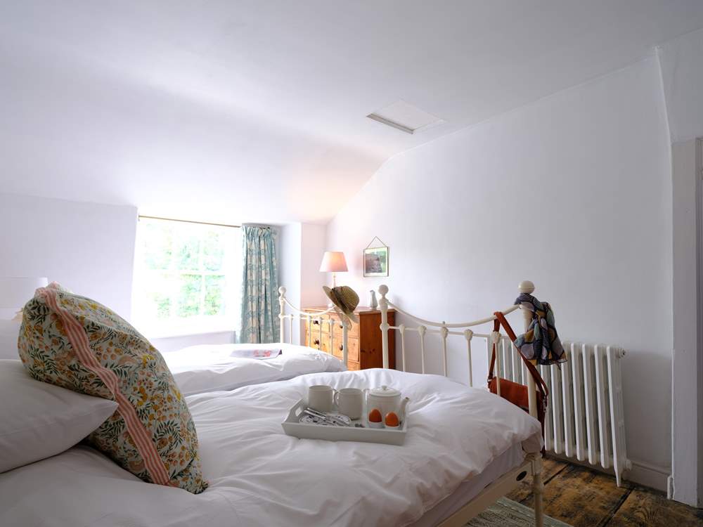 Pretty cottage style bedroom 2 has a 'zip and link' bed, perfect for a family looking for flexibility.