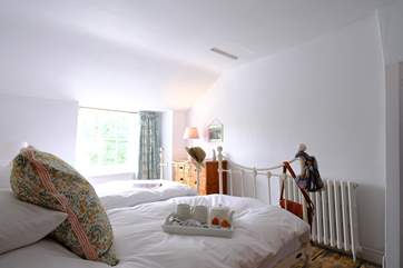 Pretty cottage style bedroom 2 has a 'zip and link' bed, perfect for a family looking for flexibility.