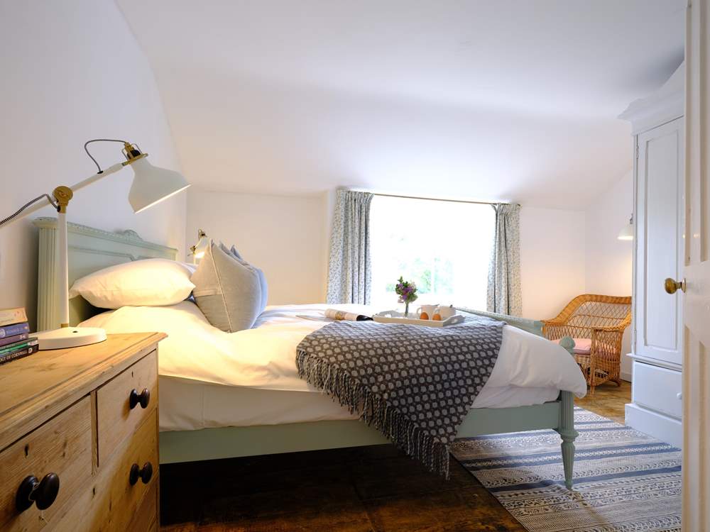 The super main bedroom is beautifully created in calming shades.