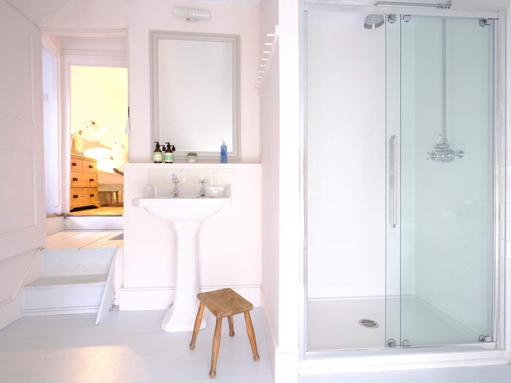 The convenient separate shower-room is on the first floor. Please note there are two steps down to the shower-room.