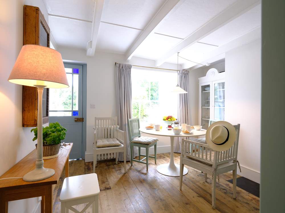 The front door leads into the dining area, from the front garden.