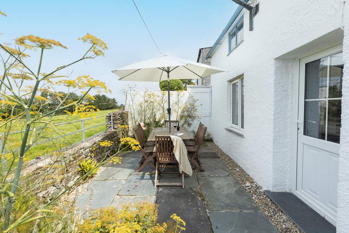 The cottage backs on to open farmland.
