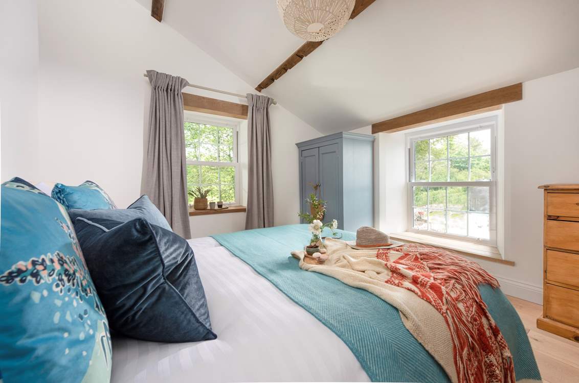 Dual-aspect, the bedroom is light and airy.