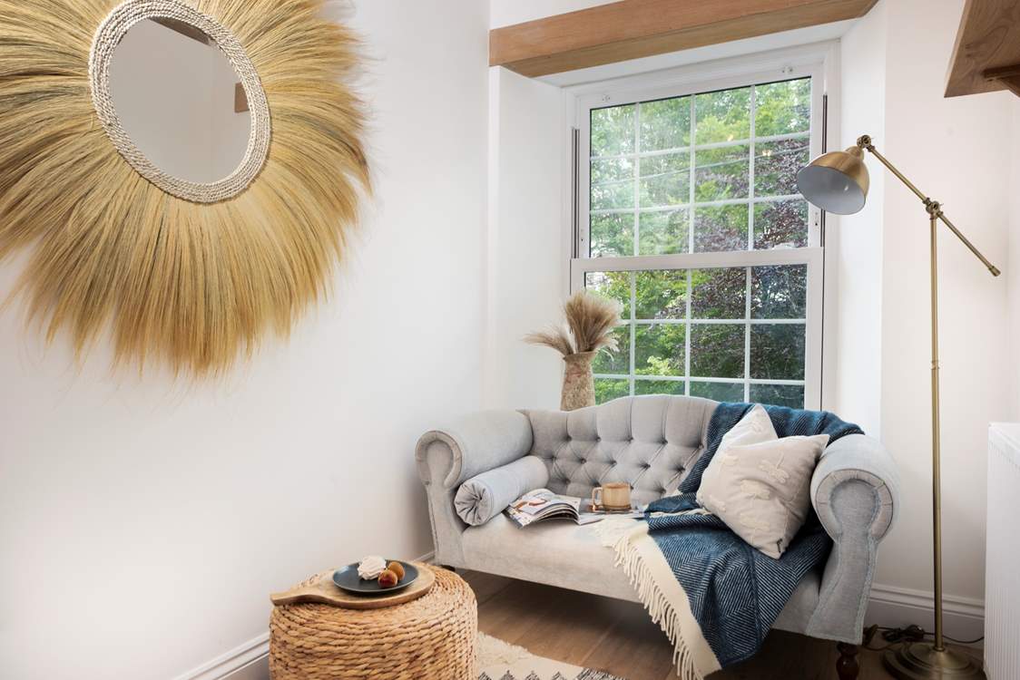 A lovely spot at the top of the stairs to bury your head in a good book.