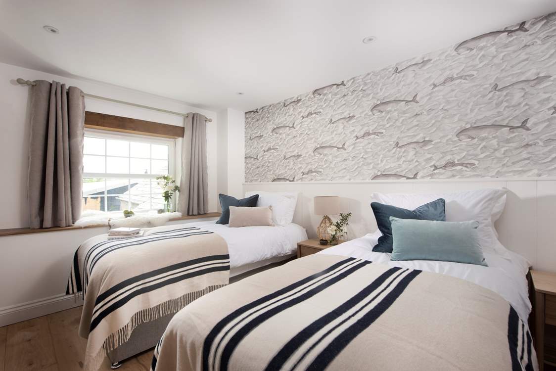 Restful tones welcome you in the third bedroom.