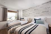 Restful tones welcome you in the third bedroom.