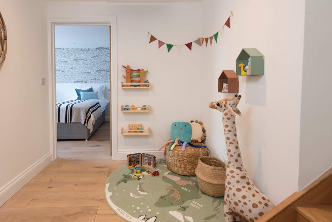 The play area on the lower landing will delight the younger members.