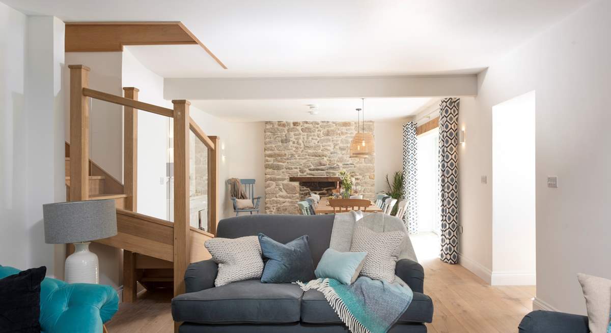 Soothing shades of blue and grey await you in the open plan sitting/dining-room.