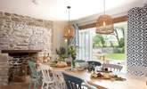 The dining-table takes pride of place in front of the picture window that leads out to the front garden. - Thumbnail Image