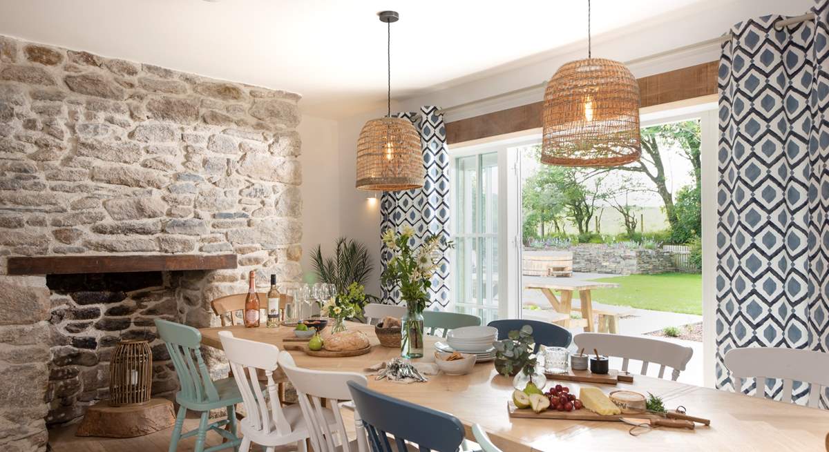 The dining-table takes pride of place in front of the picture window that leads out to the front garden.