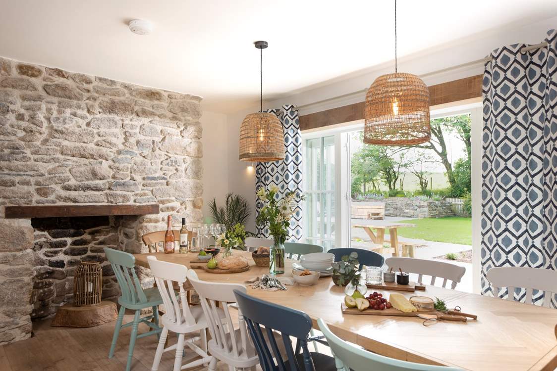 The dining-table takes pride of place in front of the picture window that leads out to the front garden.