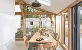 The sunny dining-area to the side of the kitchen is ideal for lazy breakfasts and holiday lunches. - Thumbnail Image