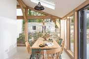 The sunny dining-area to the side of the kitchen is ideal for lazy breakfasts and holiday lunches.