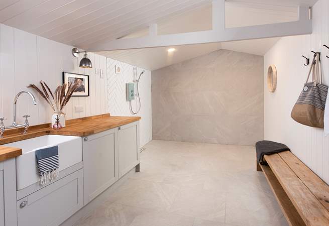 Even the utility-room is impressive, with washing and drying facilities should you need to do any laundry whilst away and a vast shower, ideal for rinsing off after a day at the beach or a stomp across the moors.