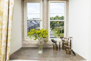 The stone window frames and windowsills are beautifully preserved.